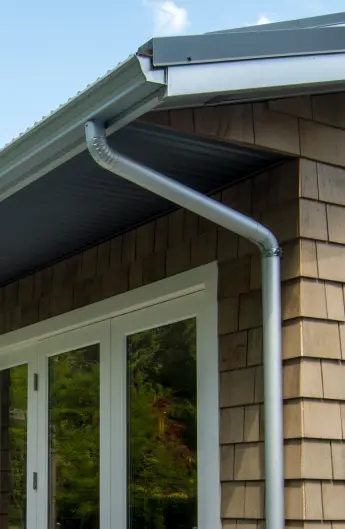 Steel downpipe gutters on Lower Mainland home.