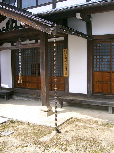 A Japanese home with a rain chain or kusari-doi.